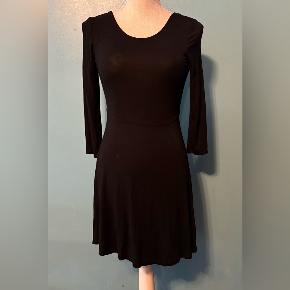 Express Black Long Sleeve Dress with round cutout in the back.